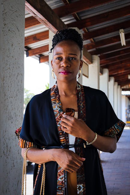 Portrait of a woman wearing traditional African attire, showcasing elegance and culture.